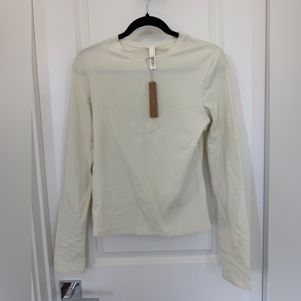 SKIMS 	COTTON JERSEY LONG SLEEVE T-SHIRT | BONE